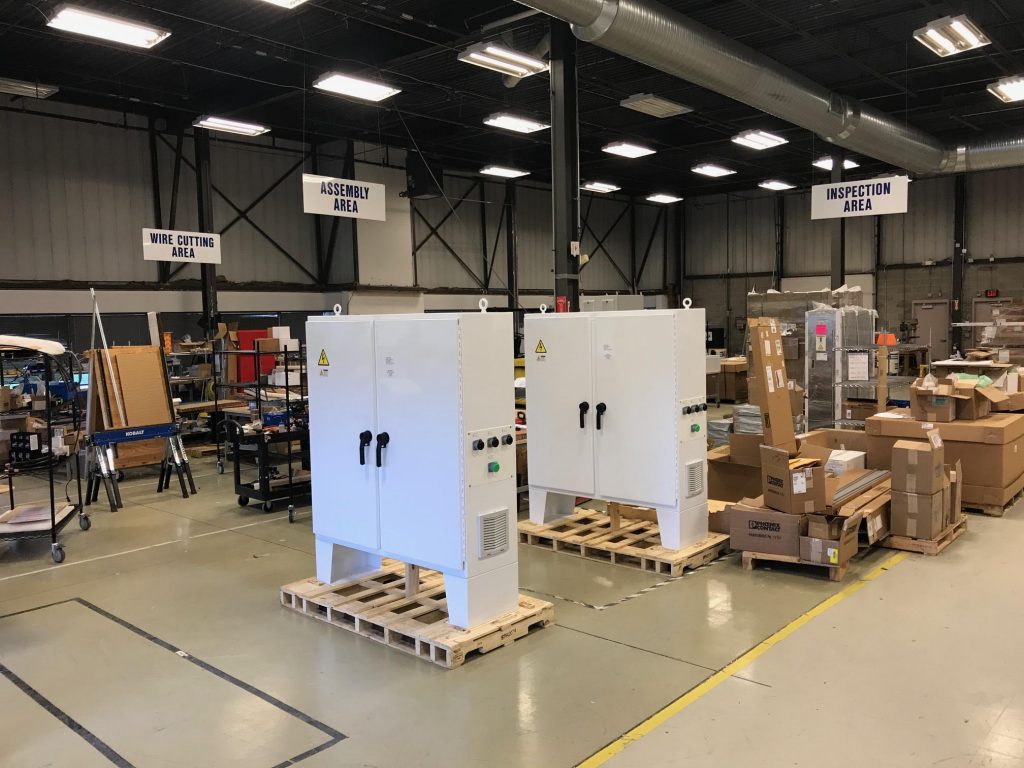 alt="ASG warehouse showing current skid projects being assembled"