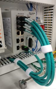 alt="close up cables within an enclosure"
